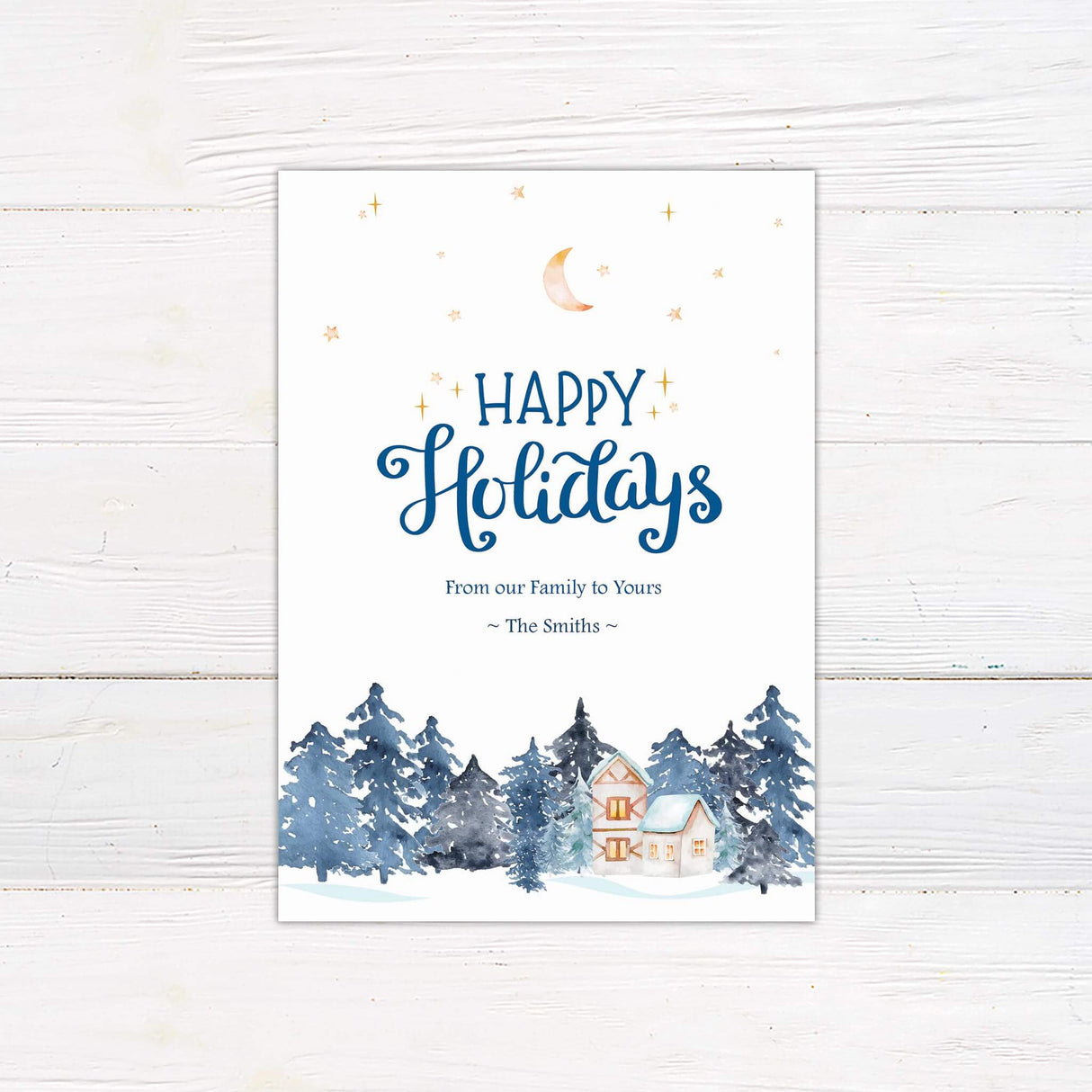 A holiday card with a snowy winter forest and a cozy house beneath a starry night sky. Customizable with family name and seasonal message.