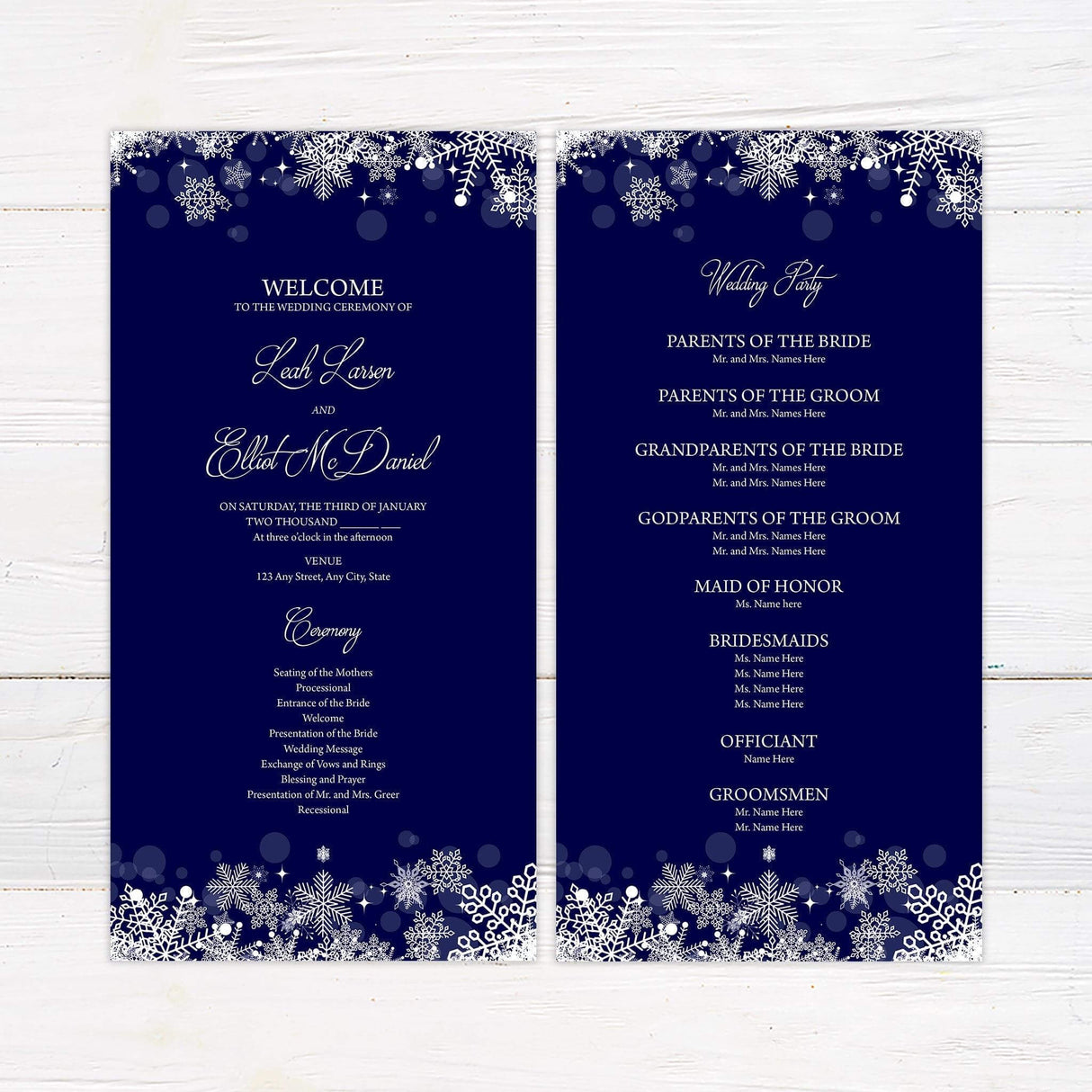 Navy blue wedding invitationprogram card with white snowflakes and elegant script for a winter theme.
