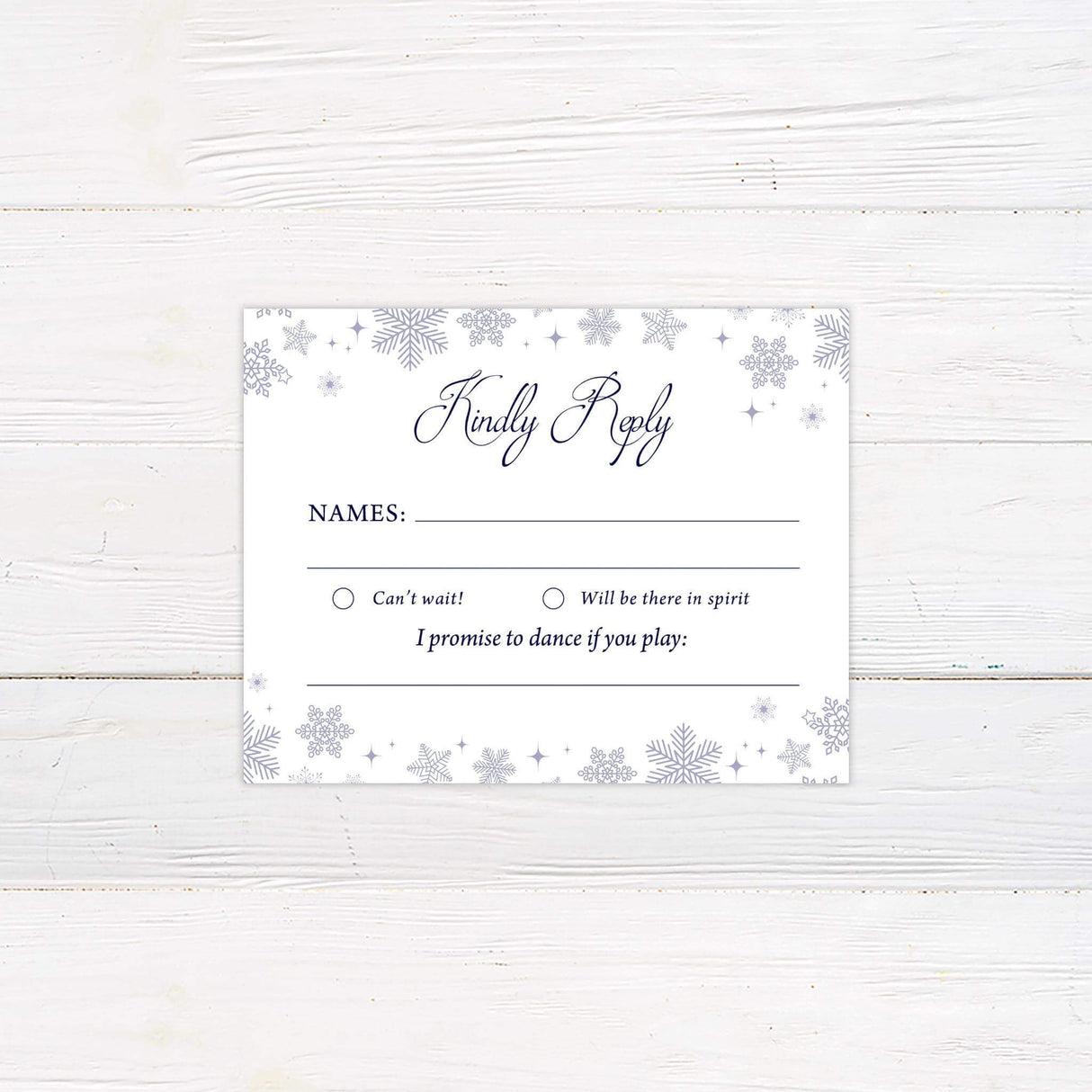 White RSVP card with snowflakes on top and bottom border and elegant script for a winter theme.