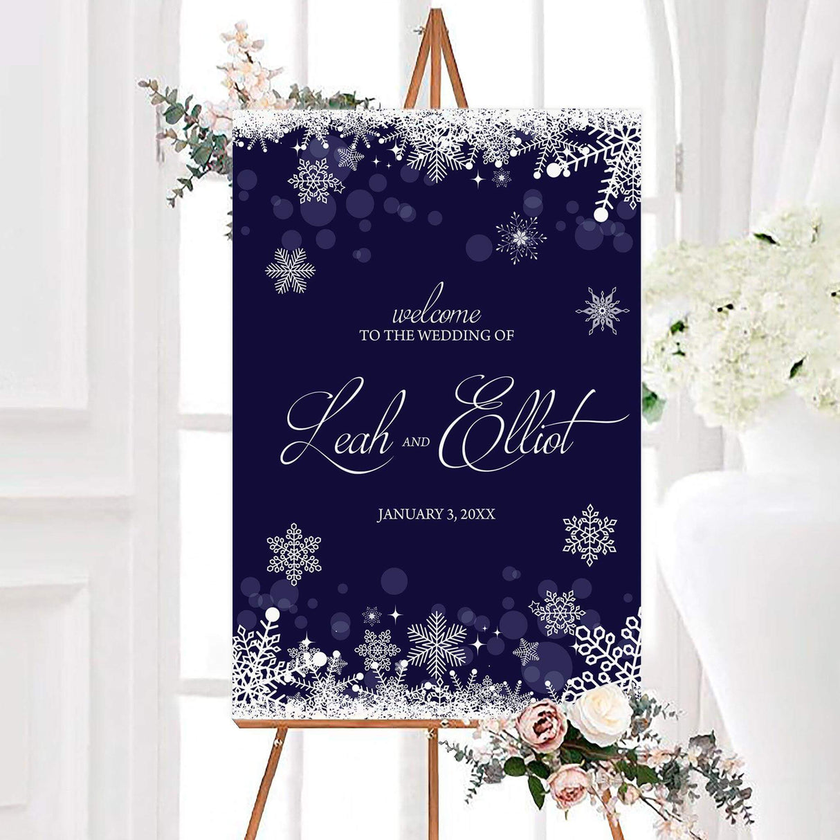 Navy blue welcome sign with white snowflakes and elegant script for a winter theme.