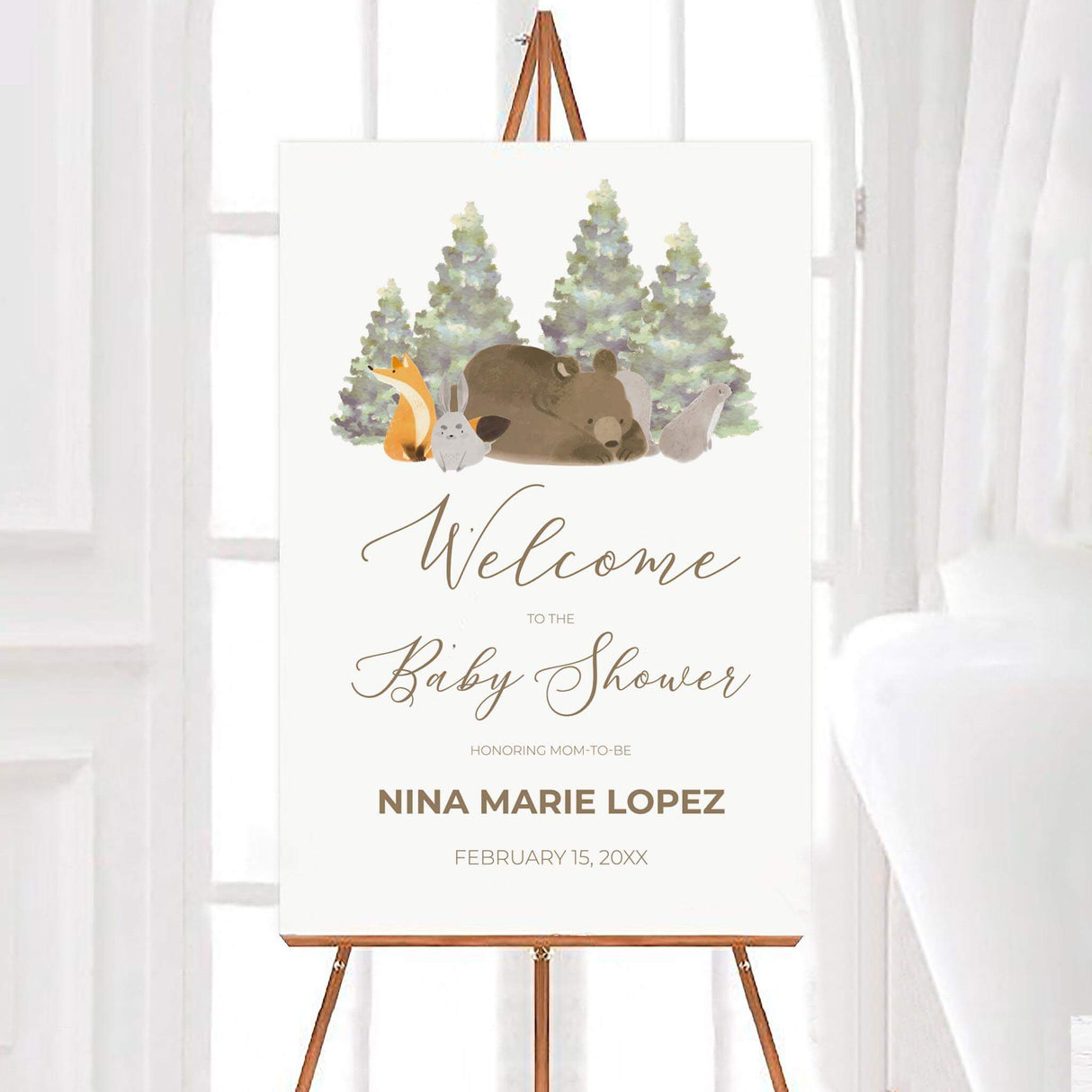 Woodland-themed baby shower invitation featuring a sleeping bear, fox, rabbit, and other forest animals with watercolor pine trees in the background. Elegant script announces with event details in a clean, modern font. Soft earth tones create a cozy, nature-inspired design perfect for celebrating a new arrival. Ideal for a rustic or outdoor-themed baby shower.