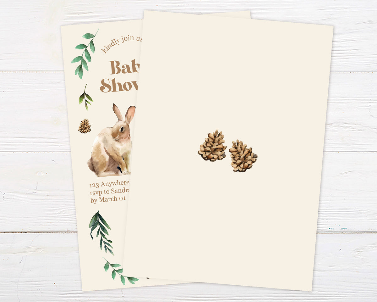 A woodland wildlife baby shower invitation featuring watercolor woodland animals and greenery. The design uses soft neutral colors on a light background. - back.