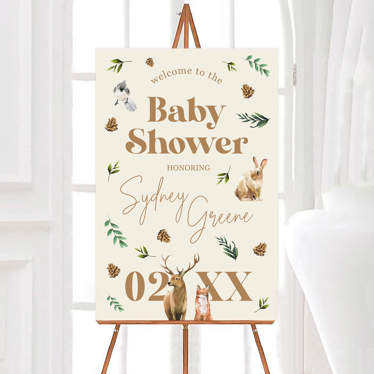 A woodland wildlife welcome sign featuring watercolor illustrations of a bird, rabbit, fox, and deer as well as forest foliage on a beige background.