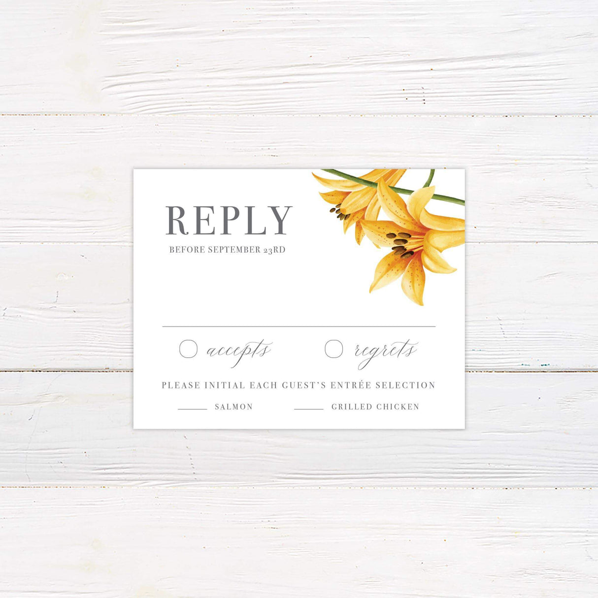 Elegant printed RSVP card with yellow lily floral design, featuring classic typography and soft botanical accents for a romantic wedding theme.