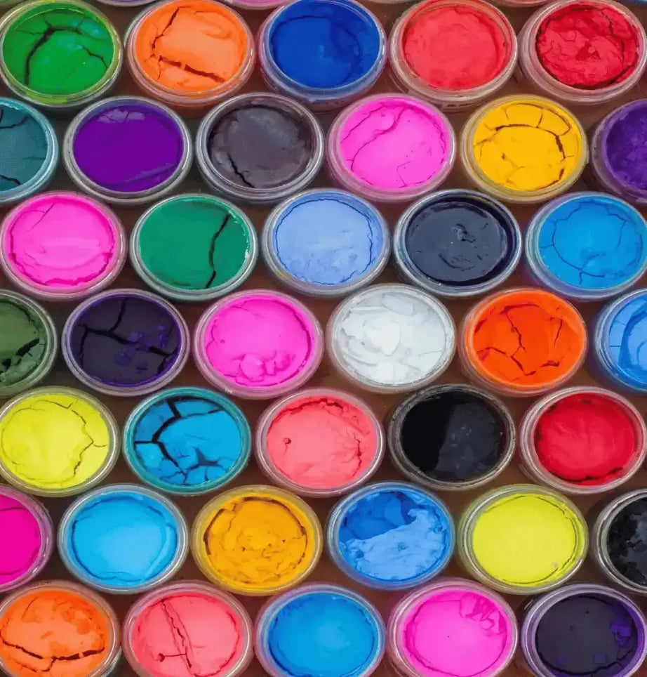 Vibrant color paints in containers illustrating creativity with Go Print Plus as your perfect print partner.