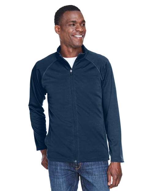 Devon & Jones Men’s Stretch Tech-Shell® Compass full-zip jacket with a sleek, modern fit and flexible performance fabric. Features a full-zip front and weather-resistant design, ideal for outdoor wear or layering.