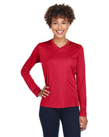 Team 365 Women’s Zone Performance long sleeve t-shirt with a lightweight, breathable design and flattering athletic fit. Features moisture-wicking fabric, making it ideal for workouts, layering, or everyday active wear.