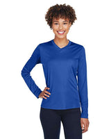 Team 365 Women’s Zone Performance long sleeve t-shirt with a lightweight, breathable design and flattering athletic fit. Features moisture-wicking fabric, making it ideal for workouts, layering, or everyday active wear.