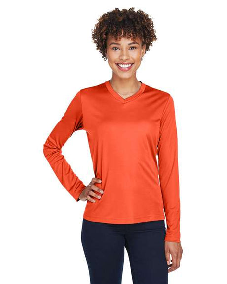 Team 365 Women’s Zone Performance long sleeve t-shirt with a lightweight, breathable design and flattering athletic fit. Features moisture-wicking fabric, making it ideal for workouts, layering, or everyday active wear.