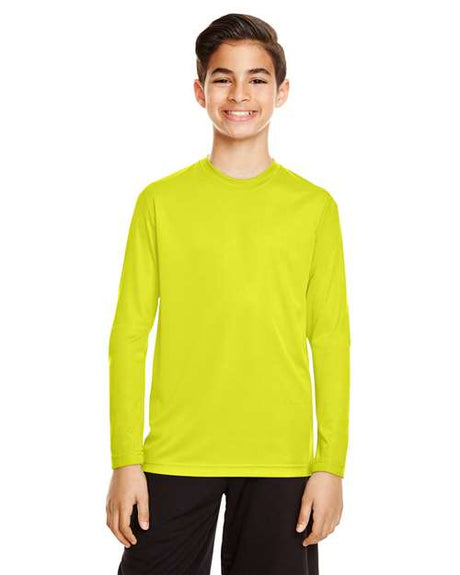 Team 365 Youth Zone Performance long sleeve t-shirt with a lightweight, breathable design and athletic fit. Features moisture-wicking fabric, making it ideal for sports, school, or everyday active wear.