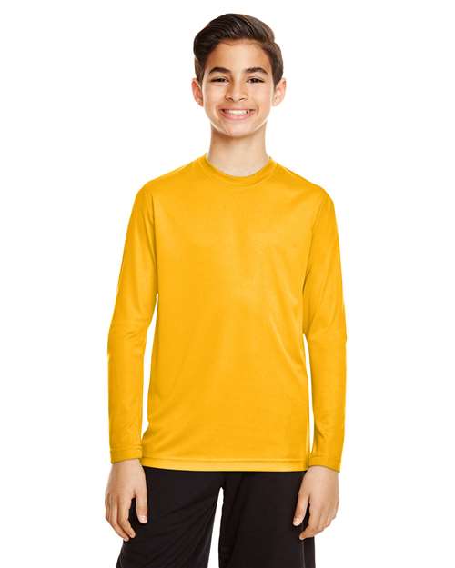 Team 365 Youth Zone Performance long sleeve t-shirt with a lightweight, breathable design and athletic fit. Features moisture-wicking fabric, making it ideal for sports, school, or everyday active wear.
