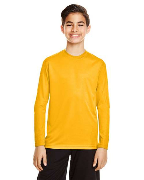 Team 365 Youth Zone Performance long sleeve t-shirt with a lightweight, breathable design and athletic fit. Features moisture-wicking fabric, making it ideal for sports, school, or everyday active wear.