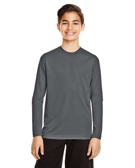 Team 365 Youth Zone Performance long sleeve t-shirt with a lightweight, breathable design and athletic fit. Features moisture-wicking fabric, making it ideal for sports, school, or everyday active wear.