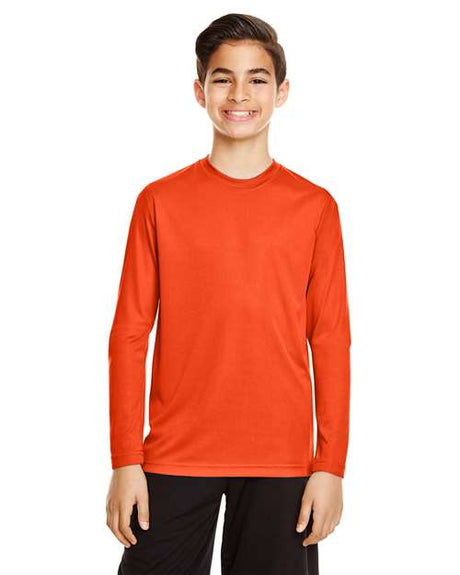 Team 365 Youth Zone Performance long sleeve t-shirt with a lightweight, breathable design and athletic fit. Features moisture-wicking fabric, making it ideal for sports, school, or everyday active wear.
