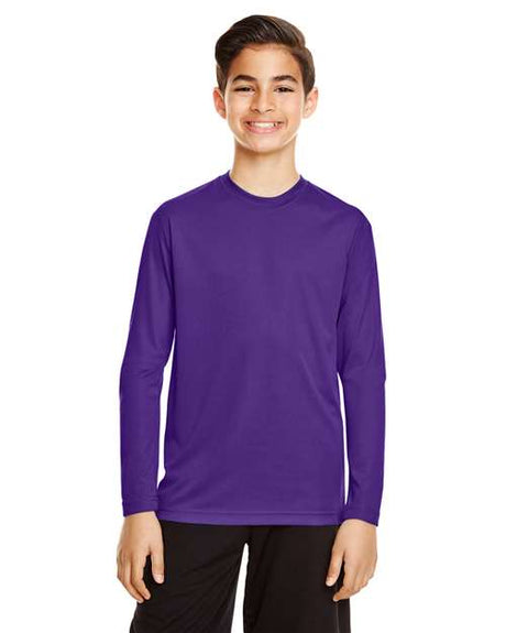 Team 365 Youth Zone Performance long sleeve t-shirt with a lightweight, breathable design and athletic fit. Features moisture-wicking fabric, making it ideal for sports, school, or everyday active wear.