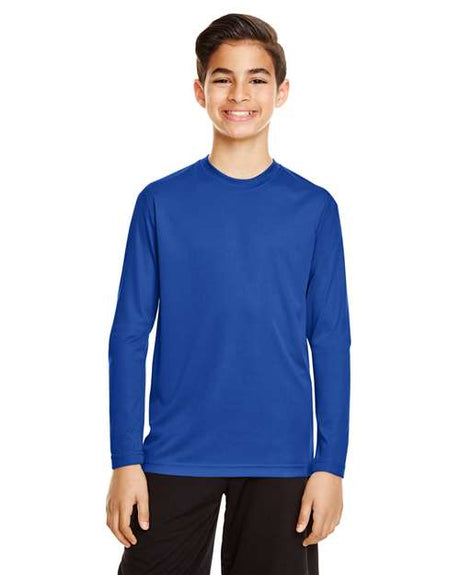 Team 365 Youth Zone Performance long sleeve t-shirt with a lightweight, breathable design and athletic fit. Features moisture-wicking fabric, making it ideal for sports, school, or everyday active wear.
