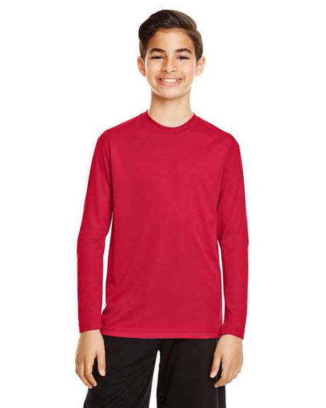 Team 365 Youth Zone Performance long sleeve t-shirt with a lightweight, breathable design and athletic fit. Features moisture-wicking fabric, making it ideal for sports, school, or everyday active wear.
