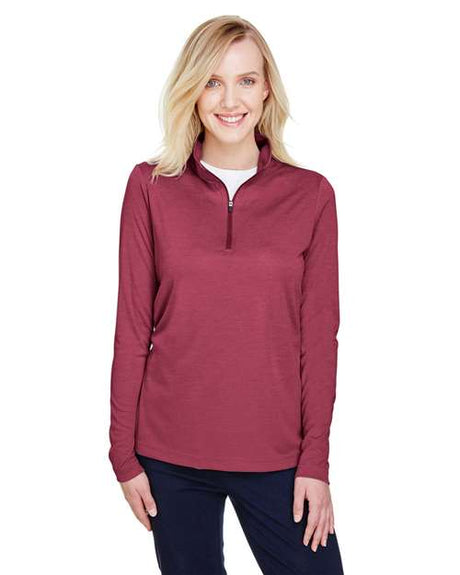 Team 365 Women’s Zone Sonic Heather performance quarter-zip pullover with a lightweight, athletic fit and heathered texture. Features moisture-wicking fabric and a zip-up collar, perfect for layering during workouts or casual wear.