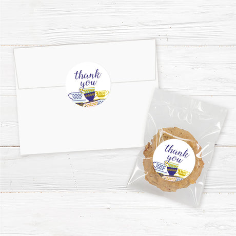 A Spot of Tea baby shower Sticker featuring an elegant stack of colorful teacups with gold and blue patterns. The design includes delicate script typography with customizable text for the honoree’s name, event date, time, and venue. Perfect for a tea party-themed baby shower, afternoon tea, or high tea celebration. Professionally printed on premium cardstock with matching envelopes included.