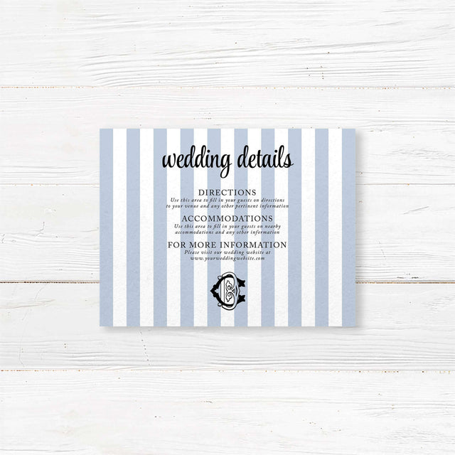Wedding detail card with vertical blue and white stripes and black monogram crest, used to share venue directions, hotel info, dress code, or other event details.