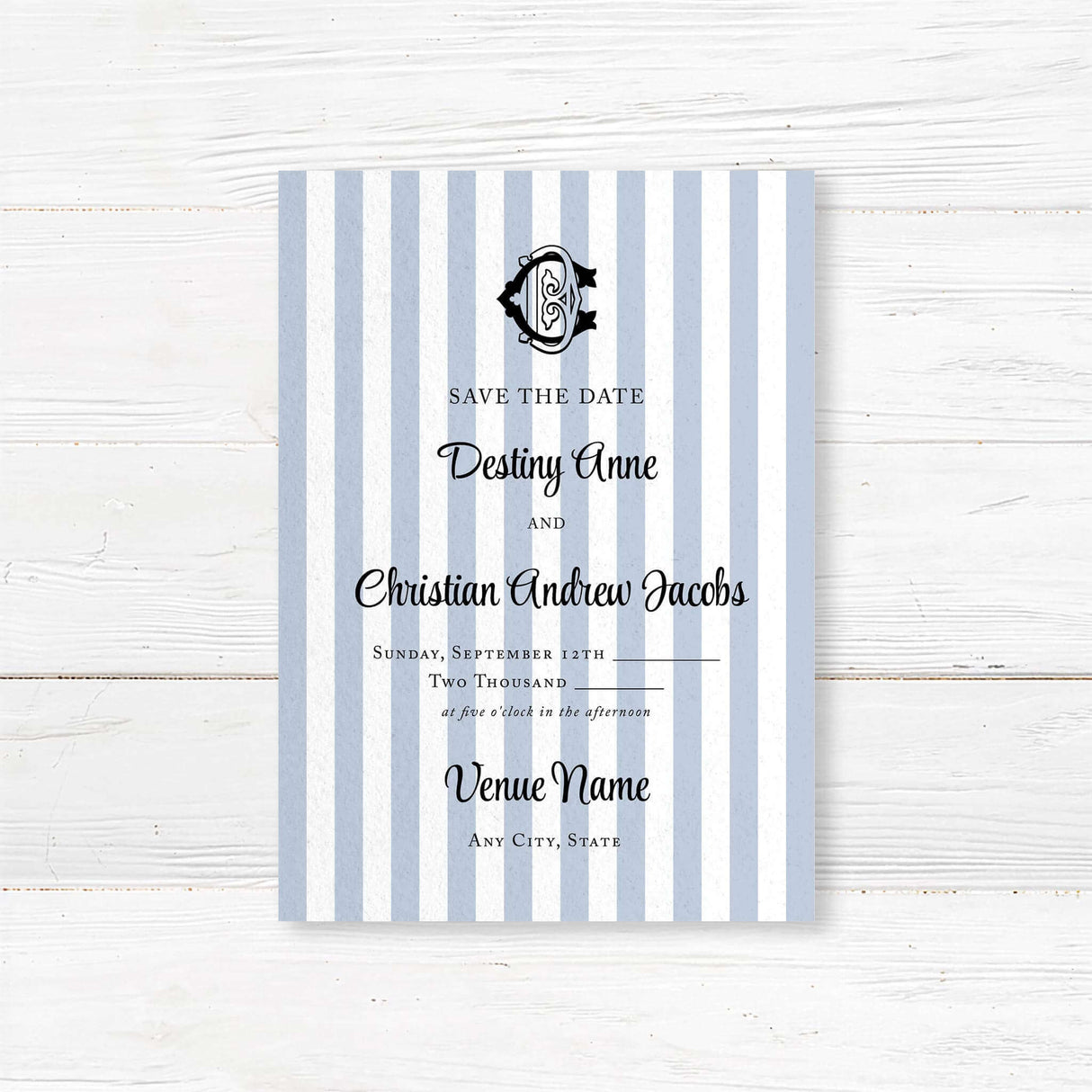 Wedding Save the Date card with blue and white stripes, black crest monogram, and classic serif and script fonts, perfect for previewing a stylish and formal wedding.