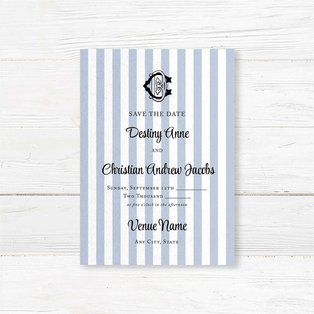 Wedding Save the Date card with blue and white stripes, black crest monogram, and classic serif and script fonts, perfect for previewing a stylish and formal wedding.