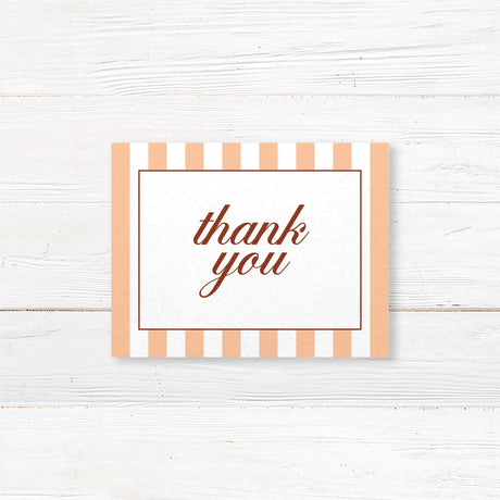 Printed thank you card with floral monogram crest, peach and terracotta stripes, and elegant fonts matching an autumn wedding suite in rustic fall colors.