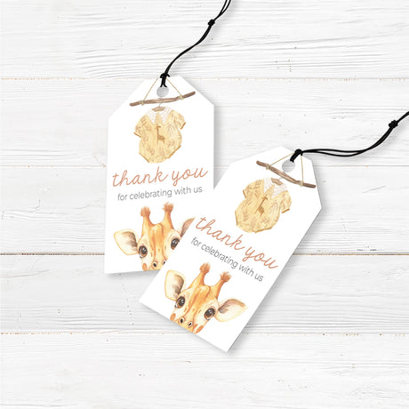 Printed safari baby shower favor tags featuring a whimsical watercolor baby giraffe illustration. Designed with a rustic wooden branch and a baby onesie, these pre-punched, pre-cut favor tags are perfect for tying onto party favors, mini gifts, or small thank-you items. Printed on thick, premium cardstock for a high-end finish. A great addition to jungle, boho, or gender-neutral baby showers, baby sprinkles, or wild one themes.