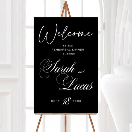 Black and white rehearsal dinner welcome sign with elegant script and serif fonts. A sophisticated design featuring a dark background with white lettering, perfect for setting a stylish and timeless tone for the event. Ideal for displaying at the venue to greet guests and honor the couple before their big day.