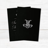 Wedding invitation with ornate Celtic-style monogram, white script and sans serif fonts, and a dramatic black background designed for formal, black-tie, or Celtic-inspired weddings. - back side