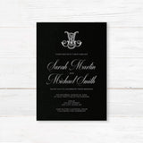 Wedding invitation with ornate Celtic-style monogram, white script and sans serif fonts, and a dramatic black background designed for formal, black-tie, or Celtic-inspired weddings.