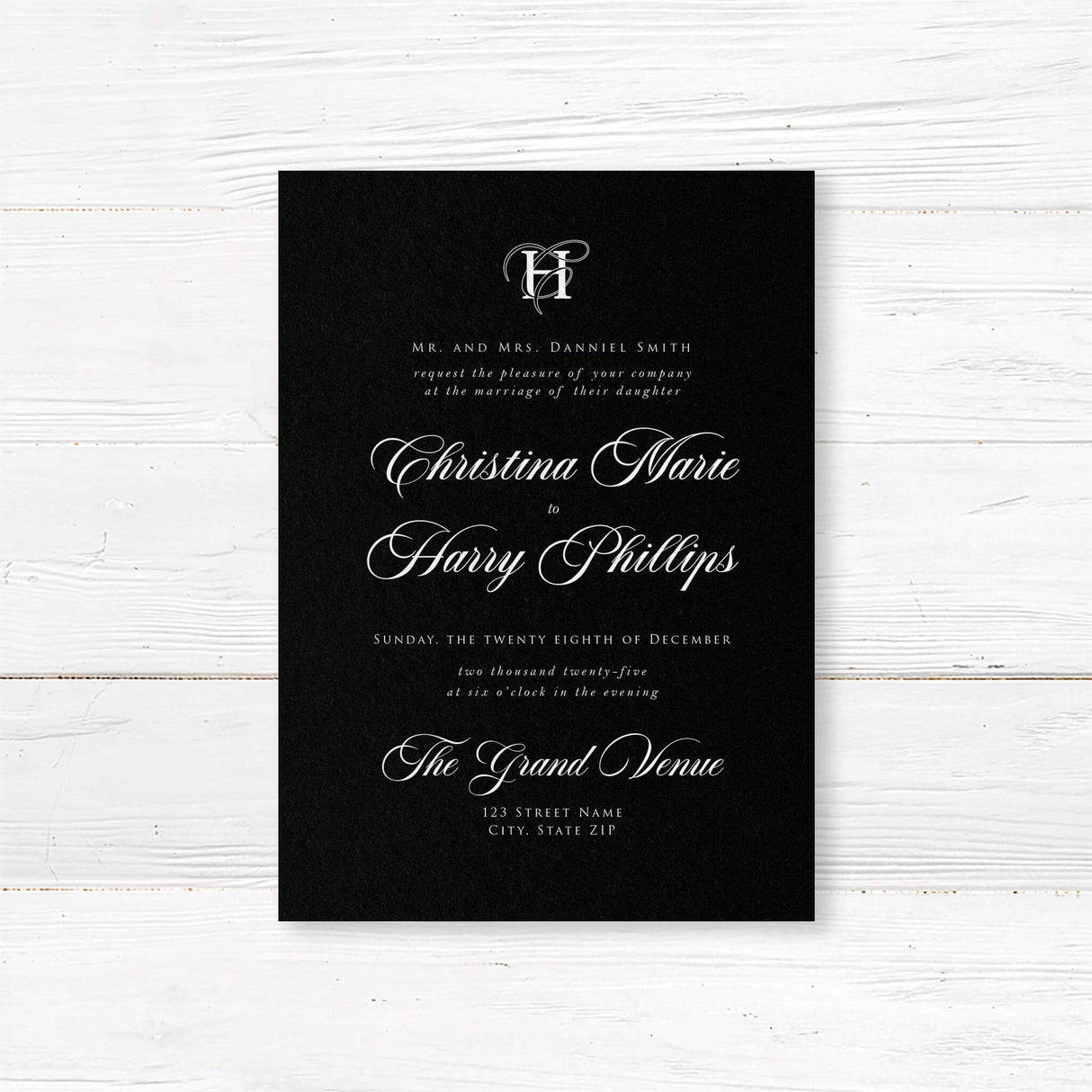 Elegant wedding invitation featuring a solid black background, ornate white monogram at the top, white serif and flourished calligraphy script fonts, and a formal centered layout for black-tie weddings.