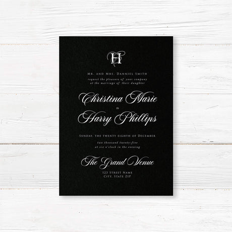 Elegant wedding invitation featuring a solid black background, ornate white monogram at the top, white serif and flourished calligraphy script fonts, and a formal centered layout for black-tie weddings.