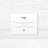 Wedding RSVP card with black background, white serif and calligraphy script fonts, elegant formal layout, and coordinates with the Black Entwined Initials invitation suite.