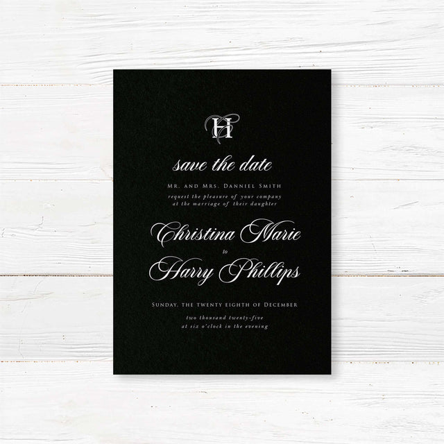 Save the Date card with solid black background, ornate white monogram at the top, and elegant white serif and calligraphy script fonts matching the Black Entwined Initials suite.