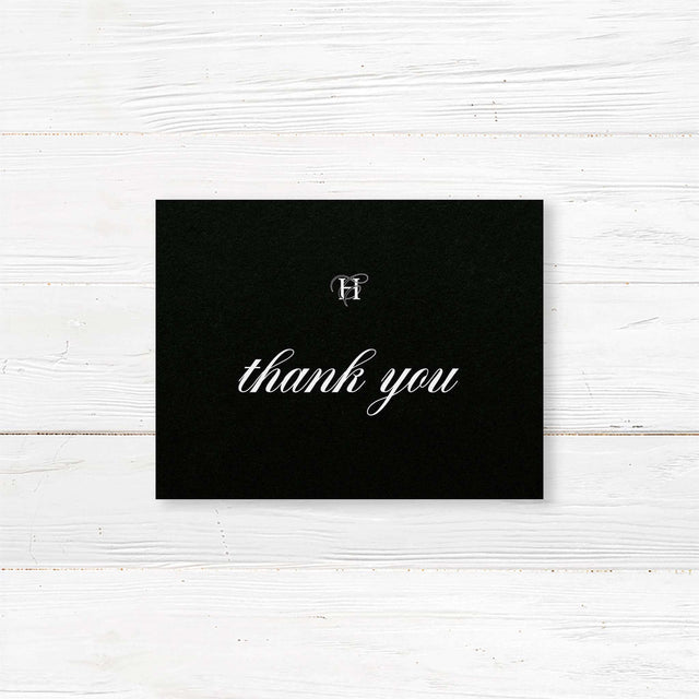 Wedding thank you card with black background, elegant white serif and script fonts, and refined formal layout to coordinate with the Black Entwined Initials wedding suite.