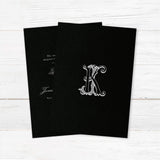 Wedding invitation with a black background, ornate Celtic monogram, and a blend of white script and serif fonts. A dramatic and elegant choice for formal or Celtic-inspired weddings. - bak side