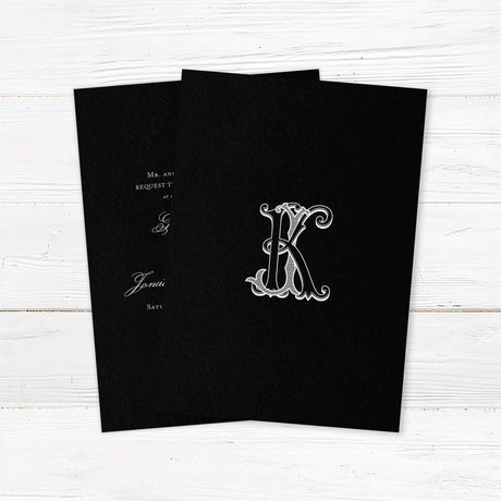 Wedding invitation with a black background, ornate Celtic monogram, and a blend of white script and serif fonts. A dramatic and elegant choice for formal or Celtic-inspired weddings. - bak side