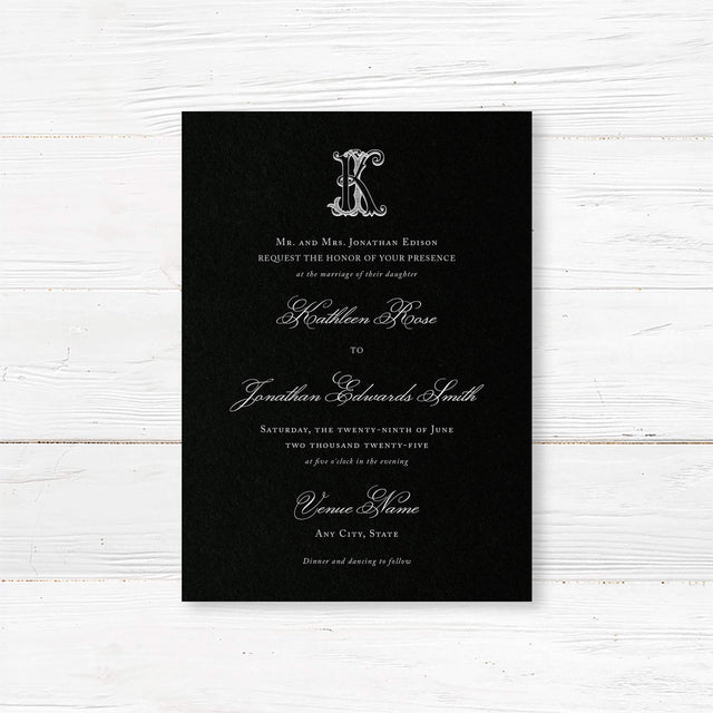 Wedding invitation with a black background, ornate Celtic monogram, and a blend of white script and serif fonts. A dramatic and elegant choice for formal or Celtic-inspired weddings.