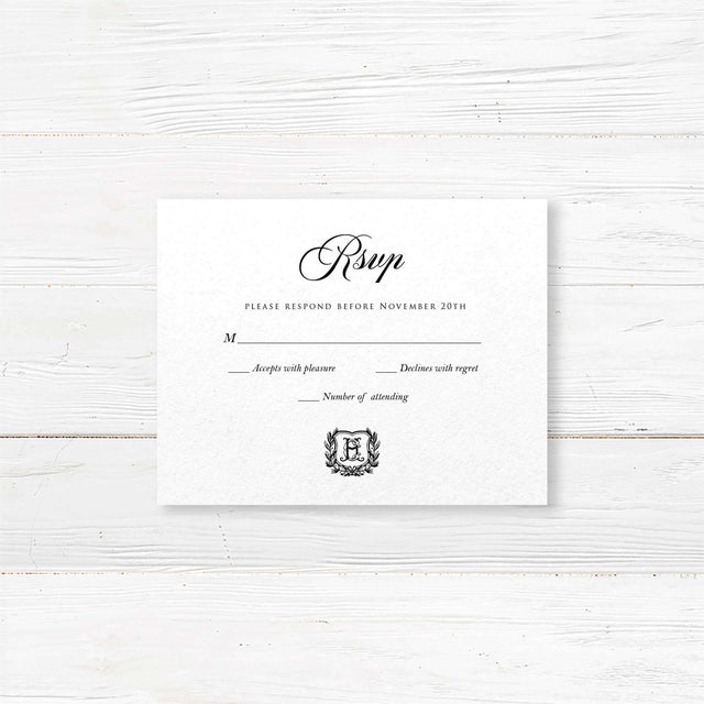 Wedding RSVP card with black background, white serif and script fonts, and a matching shield monogram design to coordinate with the Black Wreath Monogram invitation suite.