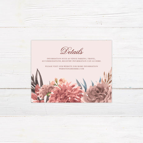 A details card with a soft neutral background features a beautiful watercolor floral arrangement in warm earthy tones of blush, burgundy, and green. The text is elegantly arranged in a mix of serif and script fonts within a centered cream-colored rectangle. Event details, including the date, time, and venue, are displayed in a structured and refined layout. This design exudes rustic elegance, perfect for boho, autumn, or garden-inspired wedding celebrations.