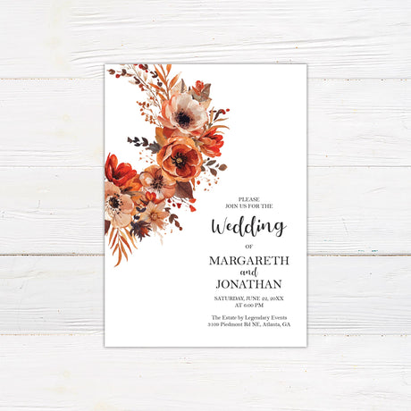 A wedding invitation with a background featuring a stunning watercolor floral arrangement in warm autumn tones of red, orange, and brown. The text is elegantly arranged in a mix of script and serif fonts, creating a sophisticated yet modern feel. Event details, including the date, time, and venue, are clearly displayed in a balanced layout. This design exudes warmth and romance, perfect for a fall, rustic, or boho-themed wedding celebration.