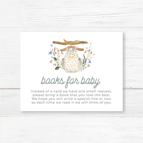 Printed baby shower book request insert card featuring a vintage-inspired baby romper with floral accents. This boho baby shower insert encourages guests to bring a book instead of a card, helping to build a meaningful baby library. Professionally printed on premium cardstock, pre-cut, and fits perfectly inside standard invitation envelopes. Ideal for woodland, floral, or rustic baby shower themes, gender-neutral baby sprinkles, or botanical baby showers.