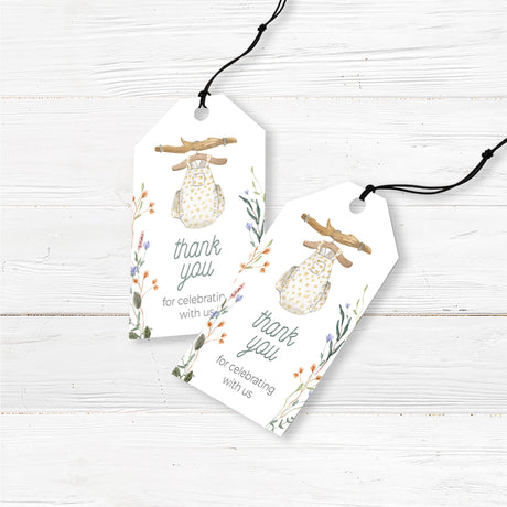 Boho baby shower favor tags featuring a delicate watercolor baby romper illustration with floral and botanical elements. Printed on thick, high-quality cardstock with pre-punched holes for easy attachment to favor bags, mini gifts, or small thank-you items. Ideal for a rustic, gender-neutral, or floral baby shower. Professionally printed and pre-cut for convenience. Pairs perfectly with our matching boho baby shower invitations and decor