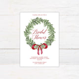 Double-sided Christmas bridal shower invitation featuring a watercolor evergreen wreath, elegant red script lettering, and a festive ribbon bow. The coordinating back design features horizontal evergreen greenery with a matching red bow on a white background.