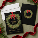 Vintage Evergreen Wreath Christmas party invitation with lush foliage, red bow, and elegant text on dark background.