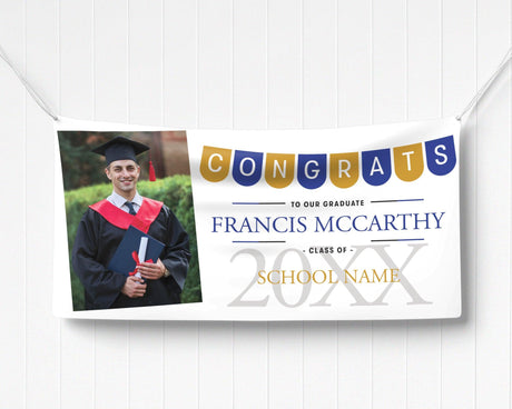 Graduation vinyl banner featuring a festive "Congrats" pennant banner, graduate photo, bold class year, and customizable school name in elegant text. blue and gold