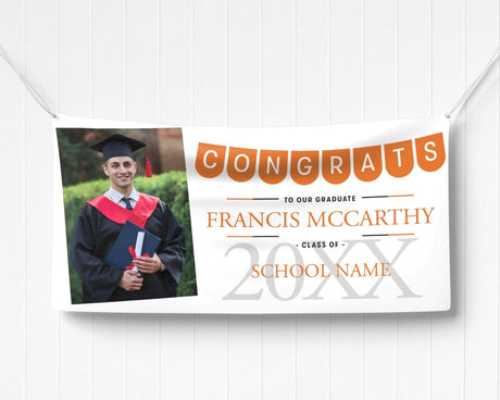 Graduation vinyl banner featuring a festive "Congrats" pennant banner, graduate photo, bold class year, and customizable school name in elegant text. orange