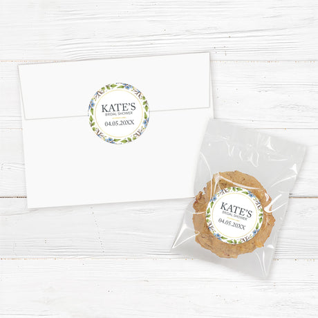 Round bridal shower sticker featuring a gold geometric frame with yellow and blue watercolor flowers, perfect for favor bags and envelope seals.