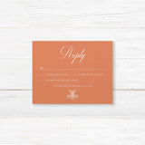 Terracotta RSVP card with white serif font for formal wedding response